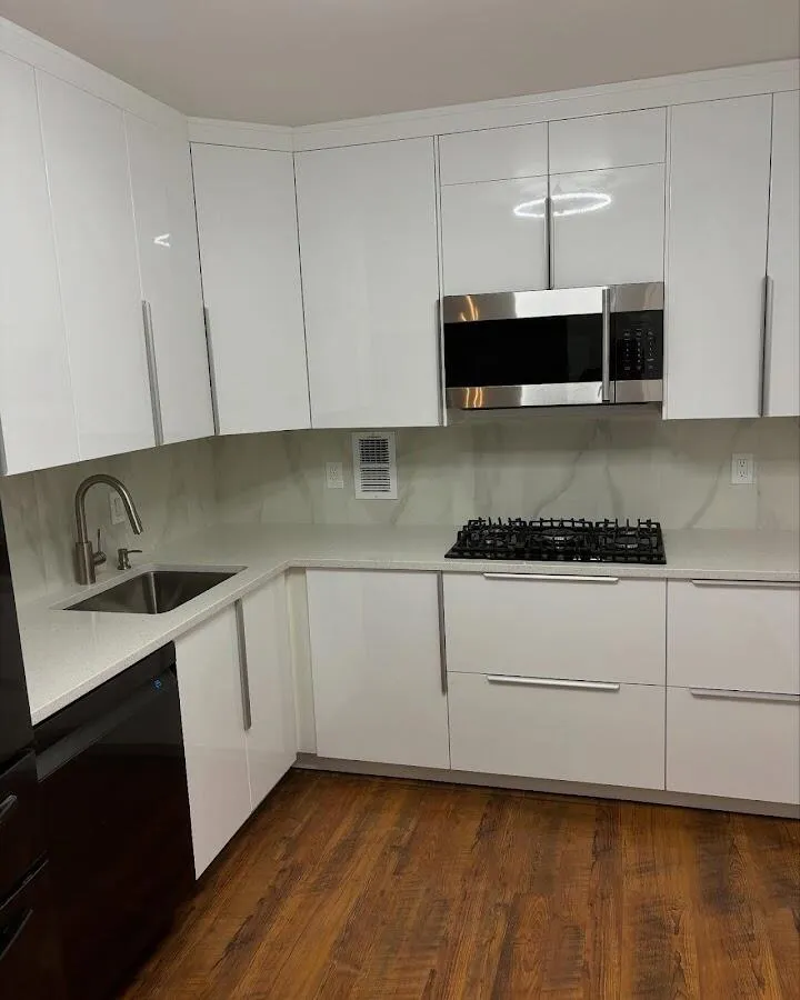 Restored kitchen with white cabinets after water damage in Triana